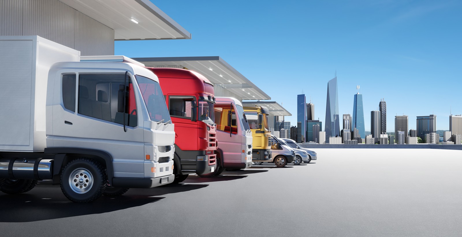 Fleet of freight and delivery trucks lined up with city skyline